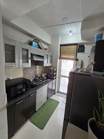 Kitchen in 2.5 BHK Apartment at Amrapali Silicon City, Sector 76 – for Sale