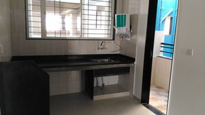 Kitchen in 2 BHK Apartment at Dreams Wisteria, Pisoli – for Rent