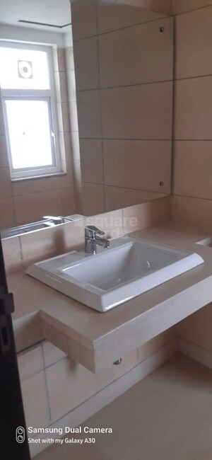 Bathroom in 4 BHK Apartment at Puri Diplomatic Greens Phase I, Sector 111 – for Rent