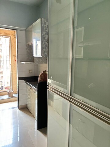 Kitchen in 1.5 BHK Apartment at Madhav Shreeji Palacia, Waghbil – for Sale