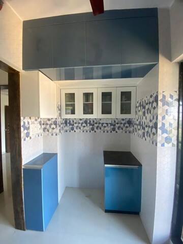 Kitchen in 1 BHK Apartment at Raunak Unnathi Woods Phase 7 A And B, Ghodbunder Road – for Rent