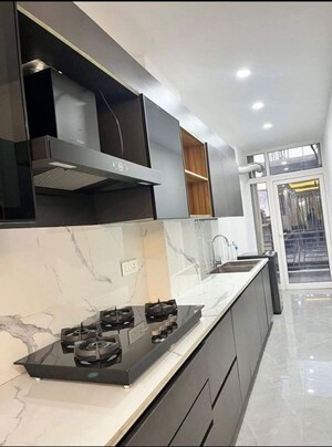 Kitchen in 2 BHK Apartment at AFOWO Raksha Addela, Sector 16c Greater Noida – for Rent