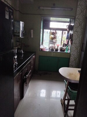 Kitchen in 2 BHK Apartment at Chhabhaiya Park, Balkum Pada – for Sale