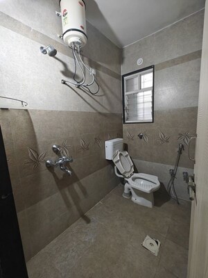 Bathroom in 2 BHK Apartment at GK Dwarka Sai, Rahatani – for Rent
