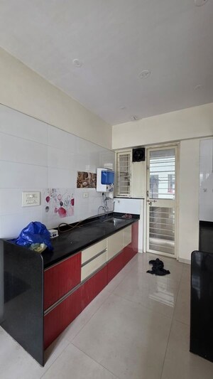 Kitchen in 1 BHK Apartment at Gulmohar Symphony, Kharadi – for Rent