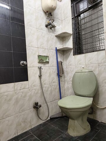 Bathroom in 2 BHK Apartment at Manali CHS Malad, Malad West – for Rent