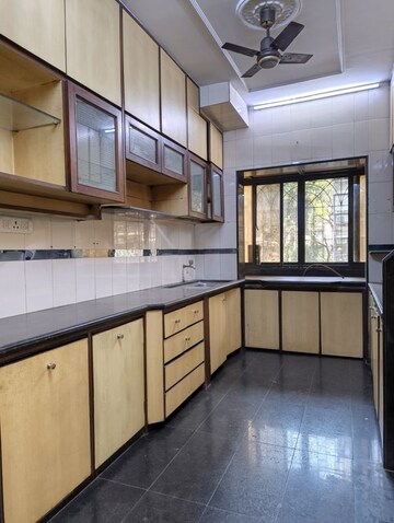 Kitchen in 2 BHK Apartment at Manali CHS Malad, Malad West – for Rent