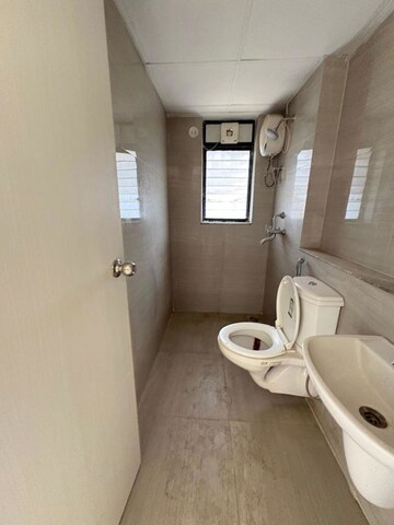 Bathroom in 3 BHK Apartment at Runwal Gardens Phase 2, Dombivli East – for Rent