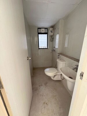 Bathroom in 3 BHK Apartment at Runwal Gardens Phase 2, Dombivli East – for Rent