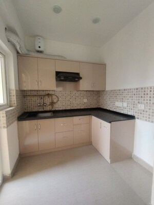 Kitchen in 2 BHK Apartment at VIctoryone Amara, Sector 16 Greater Noida – for Rent