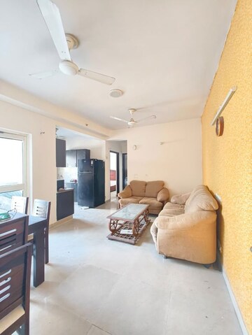 Living Room in 2 BHK Apartment at Aims Golf City, Sector 75 – for Rent