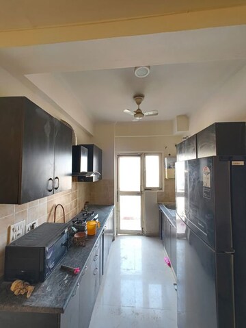 Kitchen in 2 BHK Apartment at Aims Golf City, Sector 75 – for Rent