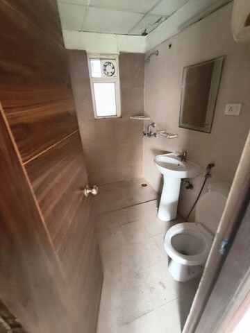 Bathroom in 3.5 BHK Apartment at Aims Golf City, Sector 75 – for Rent