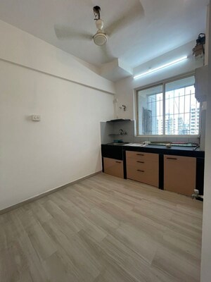 Room in 2 BHK Apartment at Grenville CHS, Andheri West – for Rent