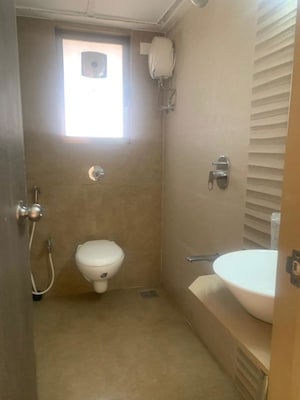 Bathroom in 3 BHK Apartment at Yashprabha CHS, Borivali West – for Rent