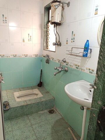Bathroom in 2 BHK Apartment at Sadguru Complex II, Goregaon West – for Rent
