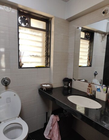 Bathroom in 2 BHK Apartment at Sadguru Poonam Heights, Goregaon West – for Rent