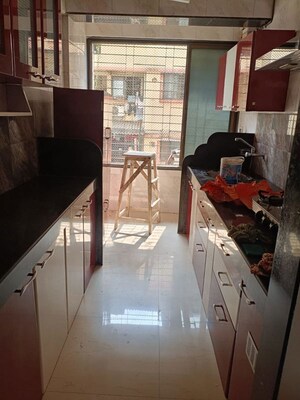 Kitchen in 2 BHK Apartment at Susheel Meadows Apartment, New Panvel – for Rent