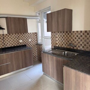 Kitchen in 4 BHK Apartment at Adani Oyster Grande Phase 2, Sector 102a – for Rent