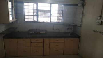 Kitchen in 1 BHK Apartment at Narmada Heights, Paud Road – for Rent