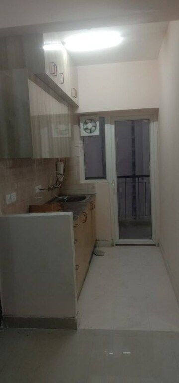 Kitchen in 1 BHK Apartment at Amrapali Dream Valley, Tech Zone 4 Greater Noida – for Sale