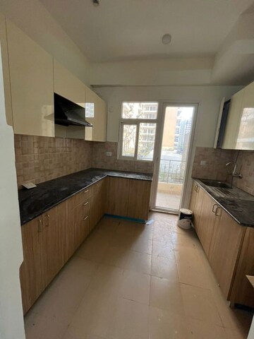 Kitchen in 3 BHK Apartment at Amrapali Crystal Homes, Sector 76 – for Rent