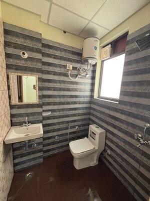 Bathroom in 3 BHK Builder Floor at Ansal Sushant Apartments, Sushant Lok I – for Rent