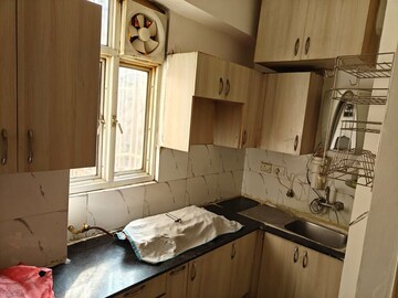 Kitchen in 2 BHK Apartment at Amrapali Golf Homes, Sector 4 Greater Noida – for Sale