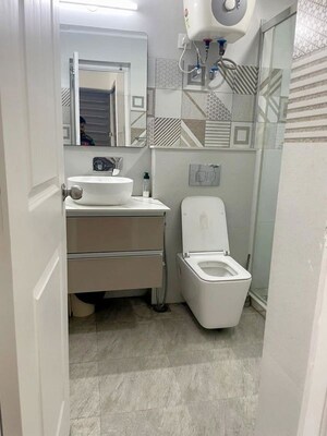 Bathroom in 4 BHK Apartment at Orchid Petals, Sector 49 – for Rent