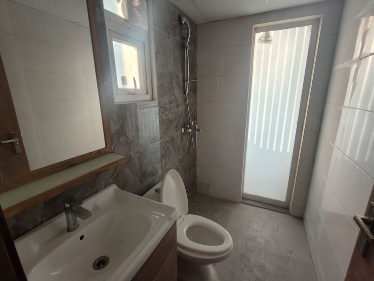 Bathroom, tulip-yellow 3 Bedroom 1704 Sq.Ft. Apartment In Sector 69 Gurgaon 9831996