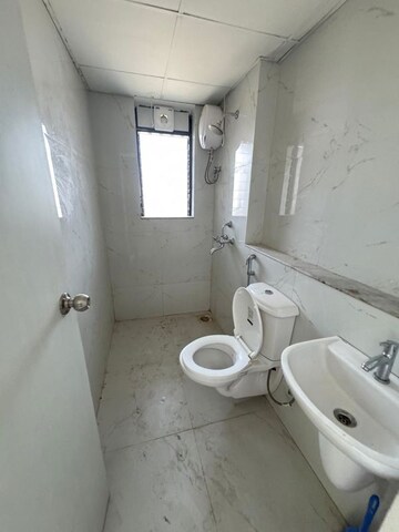 Bathroom in 3 BHK Apartment at Runwal Gardens, Dombivli East – for Rent