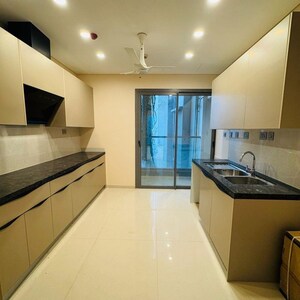 Kitchen in 4 BHK Apartment at Rustomjee Crown, Gokhale Road – for Rent