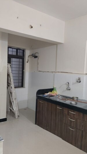 Kitchen in 2 BHK Apartment at Goel Ganga Estoria, Undri – for Sale