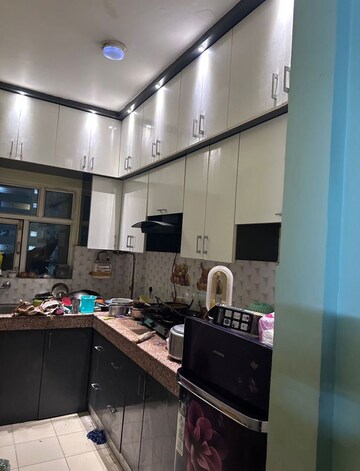 Kitchen in 2 BHK Apartment at Milan Earth, Raj Nagar Extension – for Rent