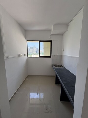 Kitchen in 1 BHK Apartment at Raunak Bliss, Ghodbunder Road – for Sale