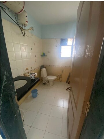 Bathroom in 2 BHK Apartment at Manikchand Malabar, Lulla Nagar – for Sale