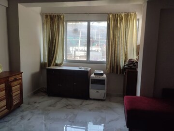 Living Room in 1 BHK Apartment at Juhu – for Rent