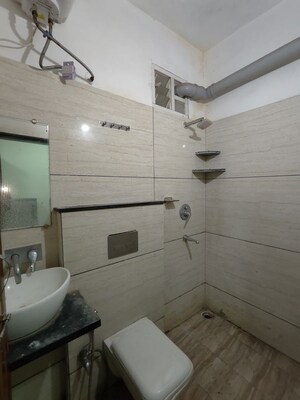 Bathroom in 1 BHK Apartment at Satguru Heights, Gulmohar Colony – for Rent