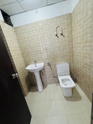 Bathroom in 2 BHK Apartment at Urban Axis Urban Woods, Sushant Golf City – for Rent