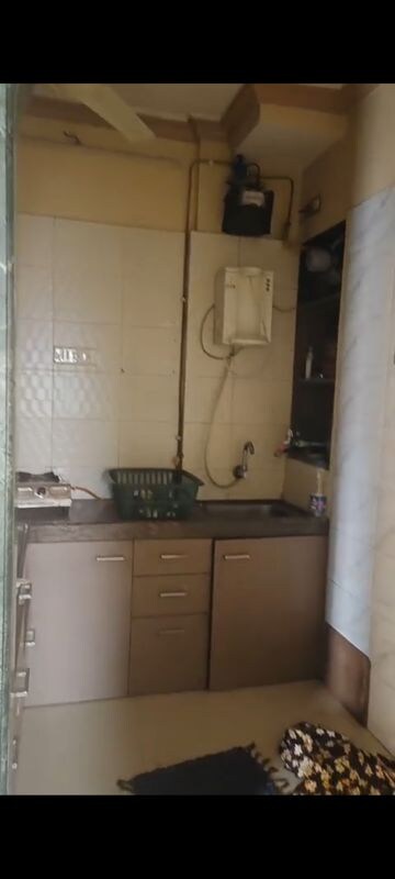Kitchen in 2 BHK Apartment at Yashraj Park CHS, Kasarvadavali – for Rent