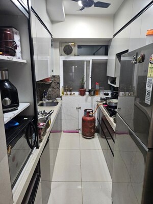Kitchen in 1.5 BHK Apartment at Shapoorji Pallonji Siennaa Wing B, Kandivali East – for Sale