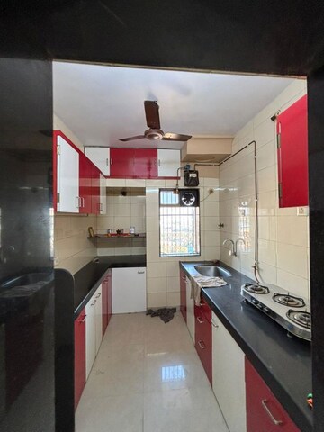 Kitchen in 2 BHK Apartment at Jambli Naka – for Sale