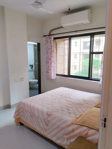 Bedroom in 2 BHK Apartment at K Raheja Palm Court, Malad West – for Rent