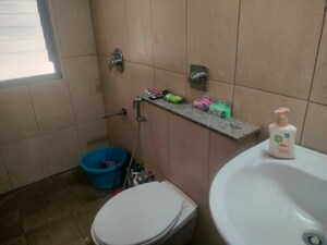 Bathroom in 2 BHK Apartment at Pride Manhattan, Charholi Budruk – for Sale