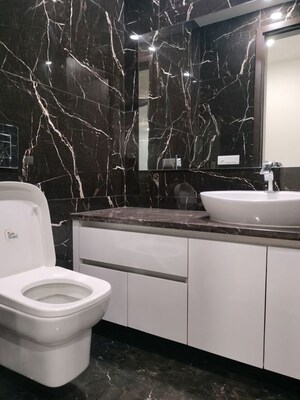 Bathroom in 4 BHK Builder Floor at Green Park Extension – for Rent