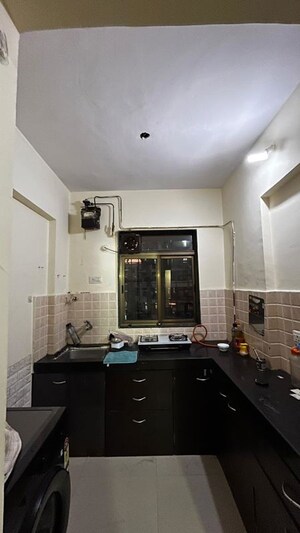Kitchen in 1 BHK Apartment at Prachi Building, Kasarvadavali – for Rent