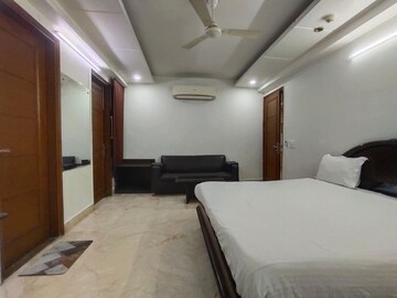 Bedroom in 4 BHK Builder Floor at South Extension I – for Rent