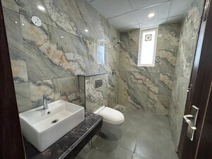 Bathroom in 3 BHK Apartment at Motia Blue Ridge, Dhakoli – for Rent