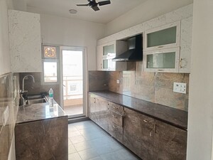 Kitchen in 2.5 BHK Apartment at Elite Golf Green, Sector 79 – for Rent