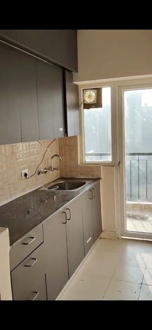 Kitchen in 1 BHK Apartment at Amrapali Dream Valley, Tech Zone 4 Greater Noida – for Rent